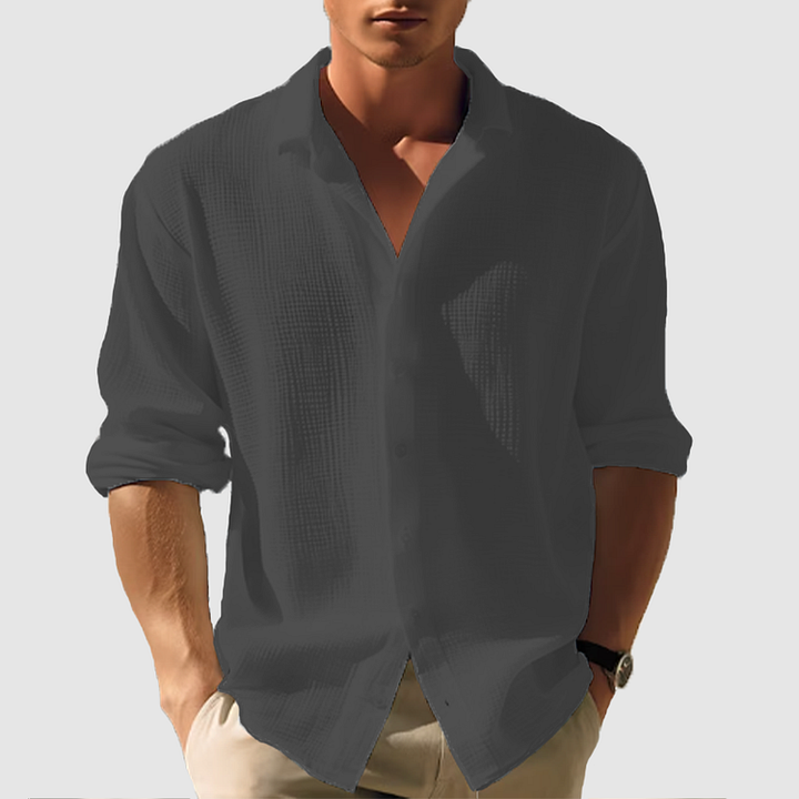 Men's casual button-down shirt, sleek design, versatile for casual or semi-formal wear, shown in light blue fabric.