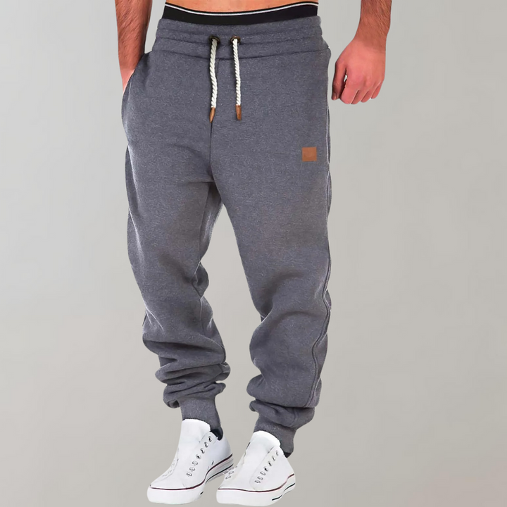 Men's Casual Jogging Pants, relaxed fit, various colors including Black, Blue, Green. Ideal for gym or casual style.