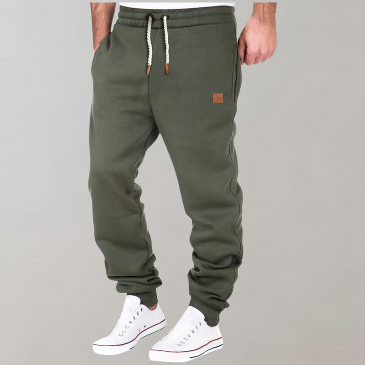 Men's Casual Jogging Pants, relaxed fit, various colors including Black, Blue, Green. Ideal for gym or casual style.