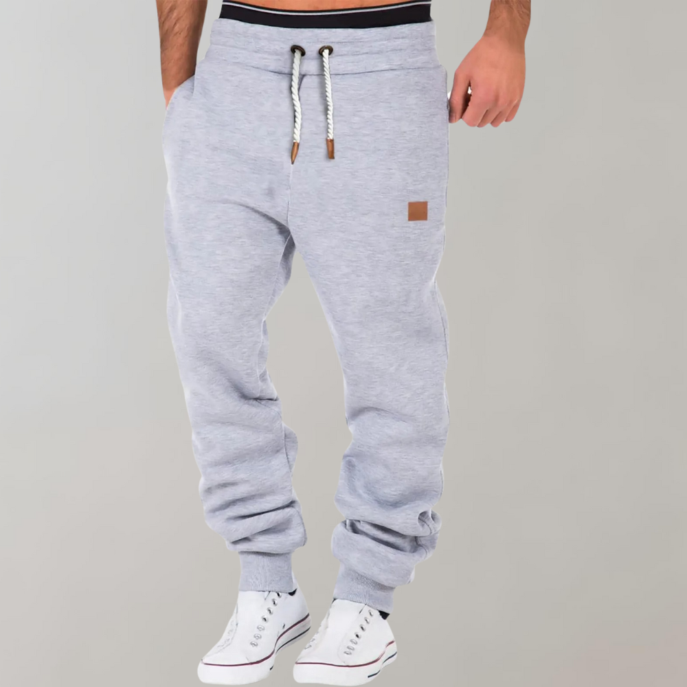 Men's Casual Jogging Pants, relaxed fit, various colors including Black, Blue, Green. Ideal for gym or casual style.