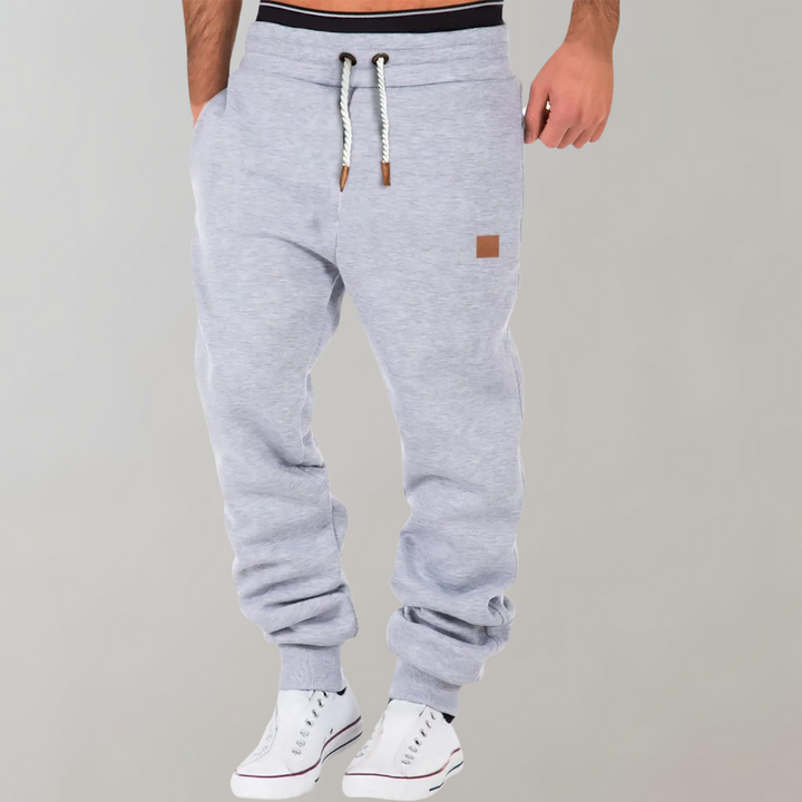 Men's Casual Jogging Pants, relaxed fit, various colors including Black, Blue, Green. Ideal for gym or casual style.
