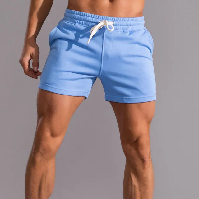 Men's casual shorts with pockets, tailored fit, breathable fabric, light color, ideal for summer outdoor activities.