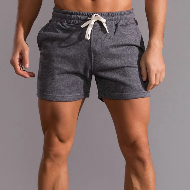 Men's casual shorts with pockets, tailored fit, breathable fabric, light color, ideal for summer outdoor activities.