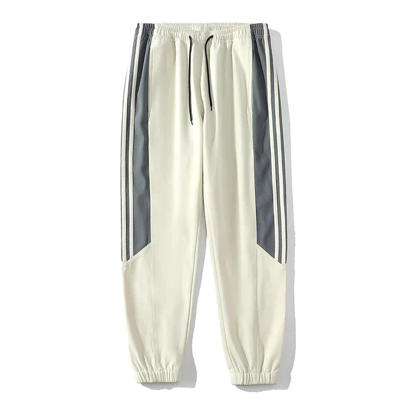 "Men's casual sports tracksuit with stylish stripe design, lightweight jacket and jogger pants, perfect for active or casual
