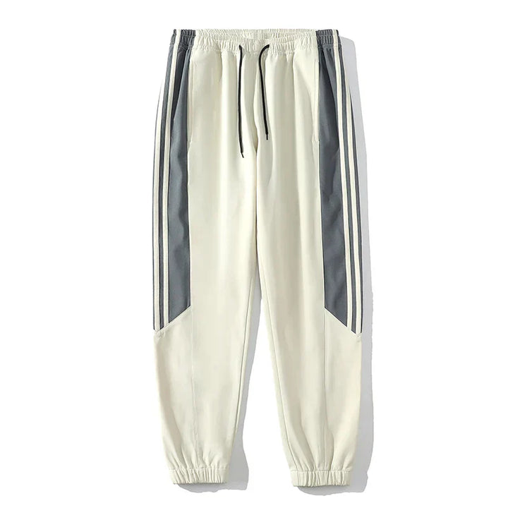 "Men's casual sports tracksuit with stylish stripe design, lightweight jacket and jogger pants, perfect for active or casual