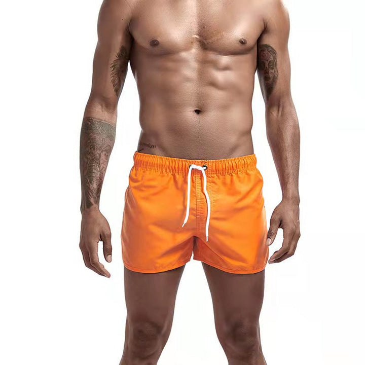 Men's casual swim shorts with adjustable waistband, relaxed fit, and versatile style, perfect for beach and pool days.