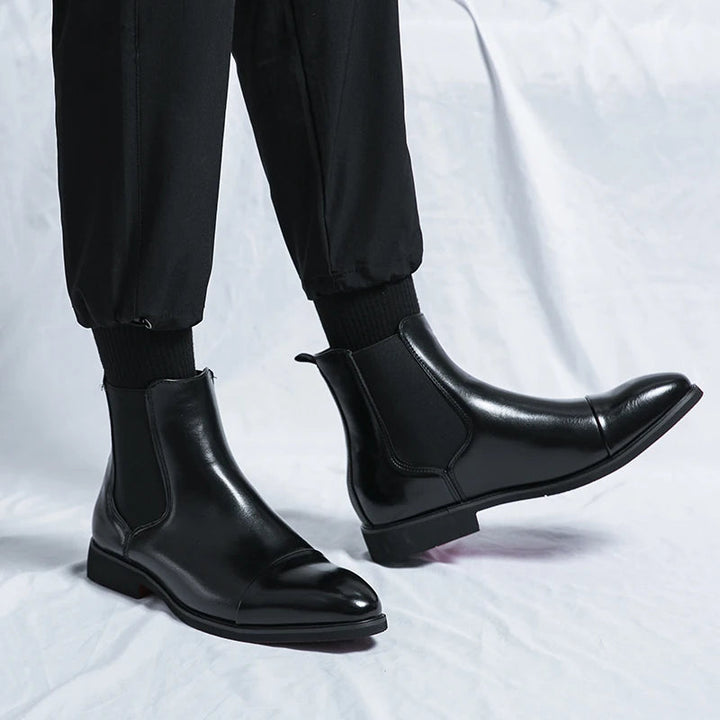 "Men's Chelsea leather boots, slip-on cap toe, ankle style, rich leather finish, versatile smart-casual footwear."