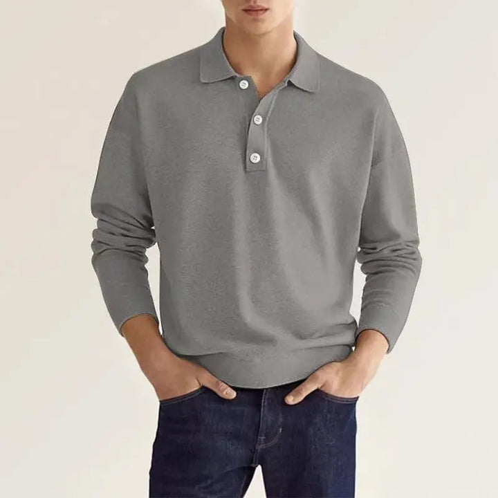 Men's classic long-sleeve polo shirt in grey with a polished collar, showcasing modern comfort and trendy fashion.
