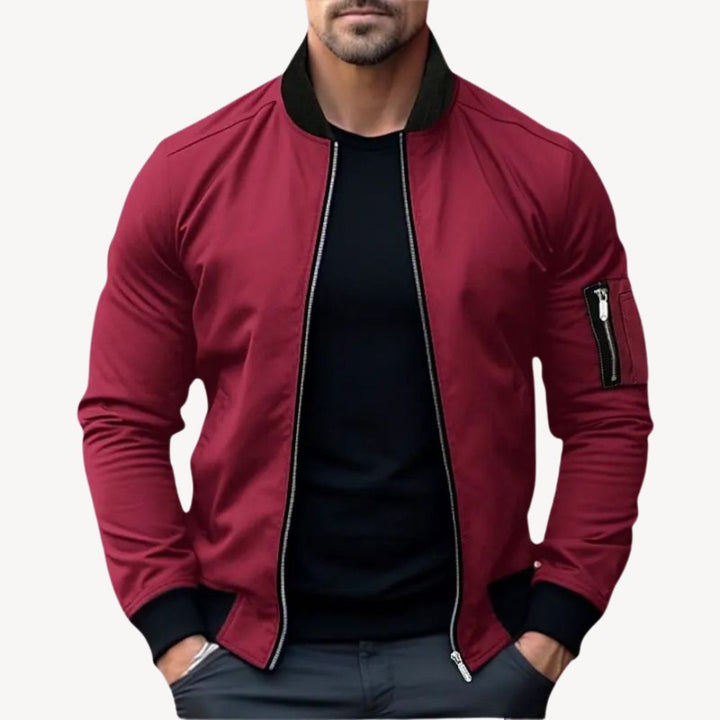 Men's classic zip-up bomber jacket with ribbed details, polyester fabric, versatile for layering, displayed front view.
