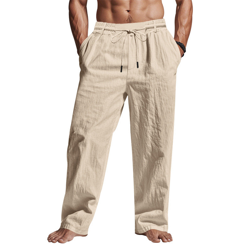 "Men's comfortable linen trousers with drawstring, relaxed fit, breathable fabric, side pockets, ideal for warm days."