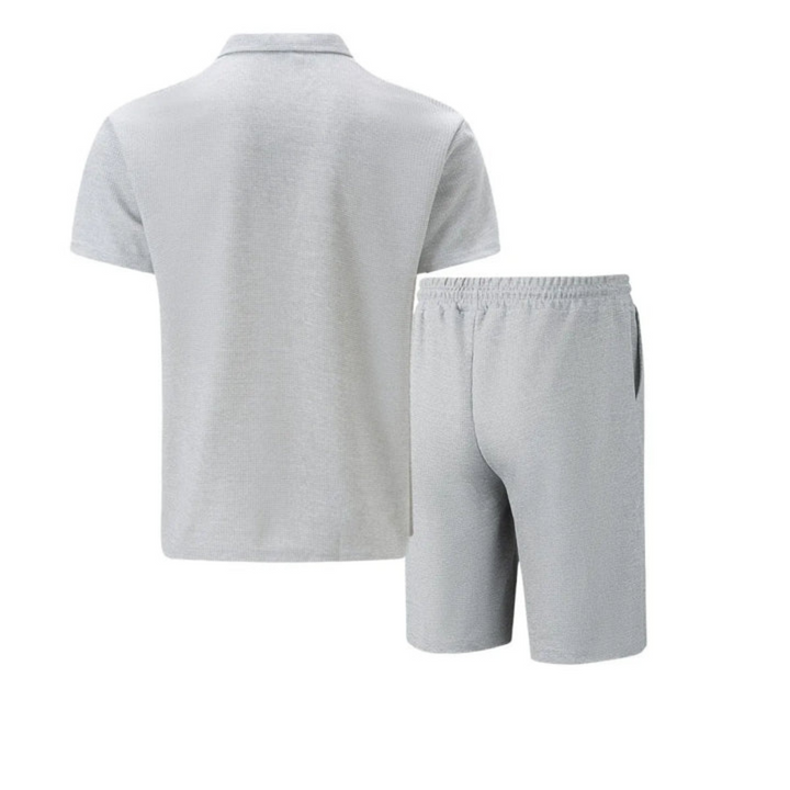 "Men's cotton co-ord set with a short-sleeved zip-neck polo and drawstring shorts, perfect for casual summer style."