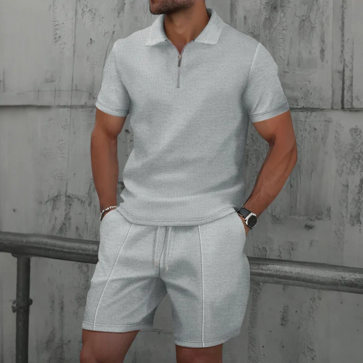 "Men's cotton co-ord set with a short-sleeved zip-neck polo and drawstring shorts, perfect for casual summer style."