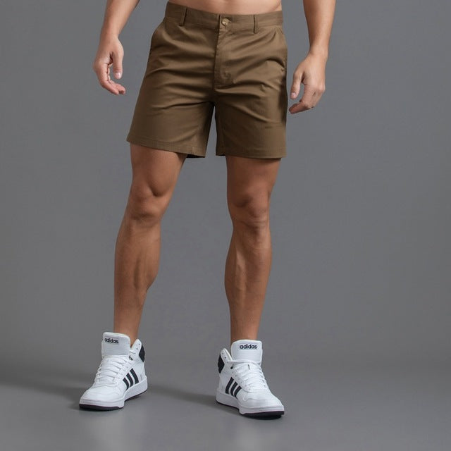 Men's cotton knee-length chino shorts in khaki, featuring a classic summer design and breathable material, ideal for casual w