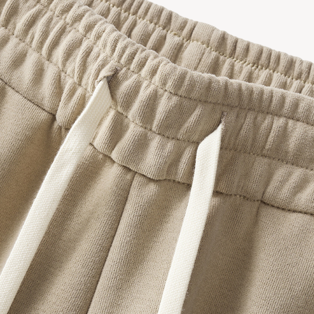 "Men's cotton tracksuit with zip-up jacket, drawstring pants; features sporty stripes, ideal for workouts or casual wear."