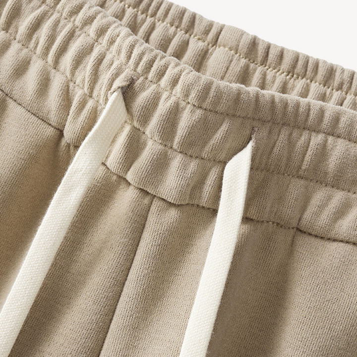 "Men's cotton tracksuit with zip-up jacket, drawstring pants; features sporty stripes, ideal for workouts or casual wear."