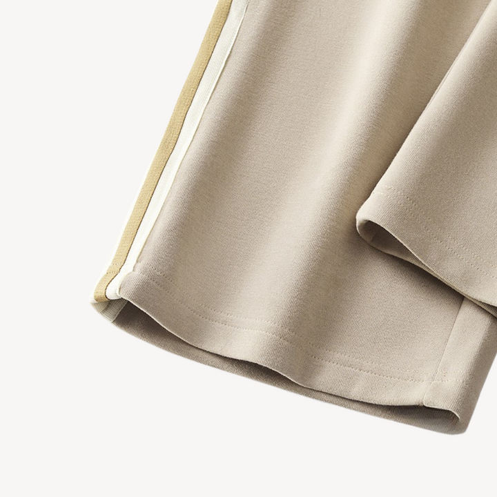 "Men's cotton tracksuit with zip-up jacket, drawstring pants; features sporty stripes, ideal for workouts or casual wear."