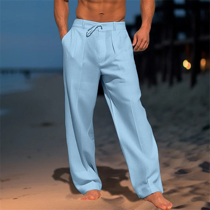 Men's full-length linen trousers with drawstring waist, relaxed fit, and pleated front, ideal for casual wear in warm weather