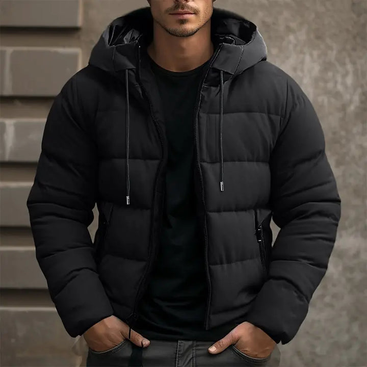 Men's insulated puffer jacket with hood, sleek black quilted design, ideal for winter warmth and style.