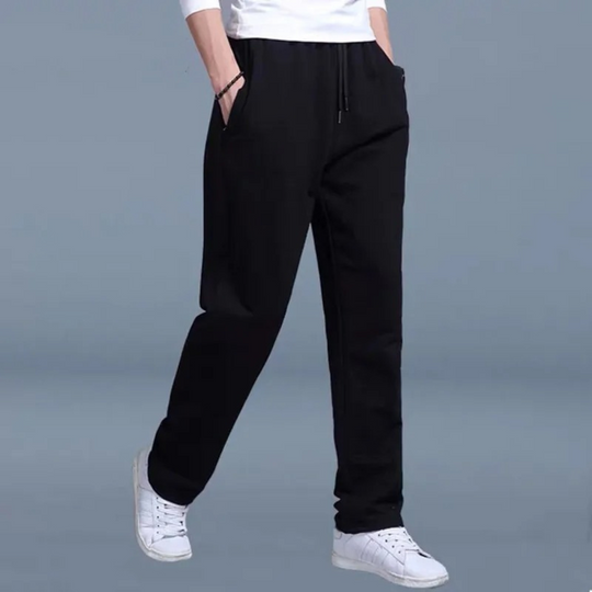 Men's jogging pants with elastic waist, tapered fit, cuffed ankles, and pockets, perfect for comfort and style.