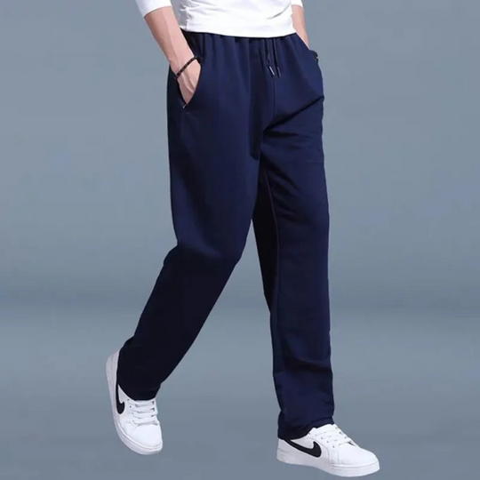 Men's jogging pants with elastic waist, tapered fit, cuffed ankles, and pockets, perfect for comfort and style.