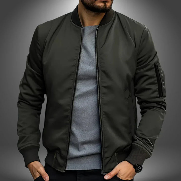 "Men's lightweight bomber jacket, casual windbreaker style with slim fit, features ribbed cuffs and arm zip pocket."