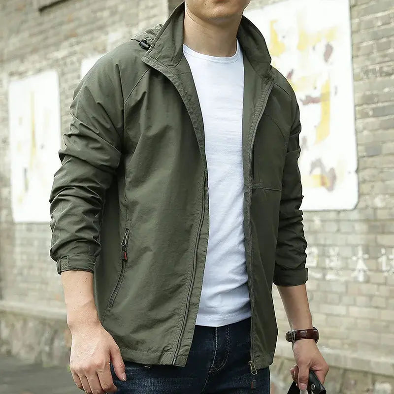 Men's lightweight breathable all-season jacket, sleek design, dark color, highlighting its comfort and versatility for layeri