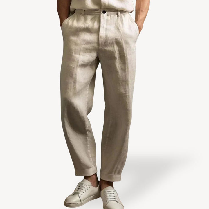"Men's lightweight linen summer pants with side pockets, available in black, green, white, and khaki, shown in relaxed fit."