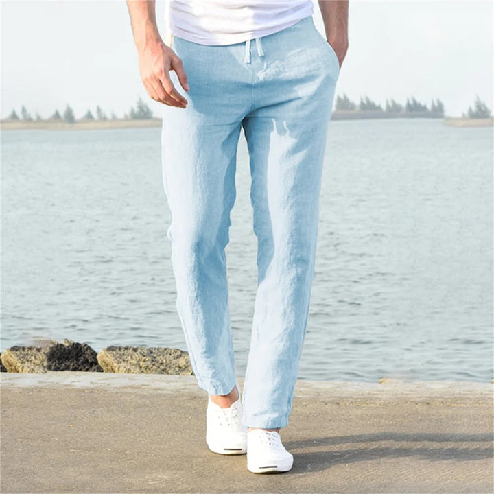 Men's lightweight linen trousers, casual and versatile, in light blue, showcasing a modern, relaxed fit and breathable fabric