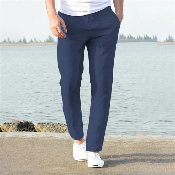 Men's lightweight linen trousers, casual and versatile, in light blue, showcasing a modern, relaxed fit and breathable fabric