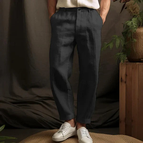 "Men's lightweight linen trousers in light beige, showcasing a relaxed fit for summer comfort and versatile style."