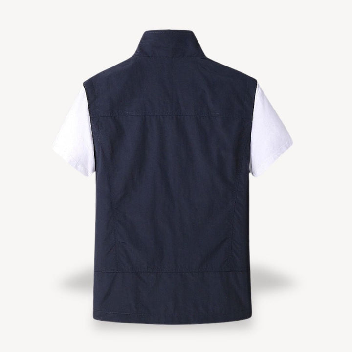 Men's lightweight quilted vest, stylish layering in navy blue, full zip, insulated yet non-bulky, perfect for cooler seasons.