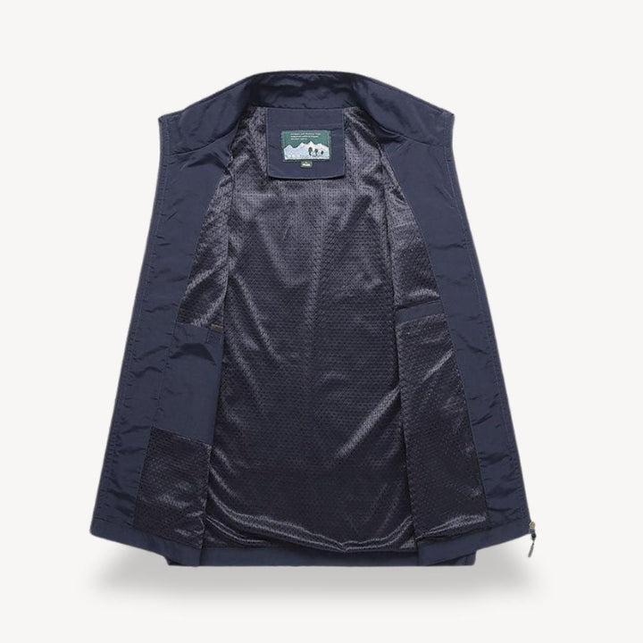 Men's lightweight quilted vest, stylish layering in navy blue, full zip, insulated yet non-bulky, perfect for cooler seasons.