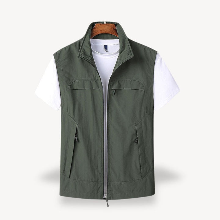 Men's lightweight quilted vest, stylish layering in navy blue, full zip, insulated yet non-bulky, perfect for cooler seasons.
