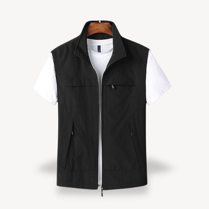 Men's lightweight quilted vest, stylish layering in navy blue, full zip, insulated yet non-bulky, perfect for cooler seasons.