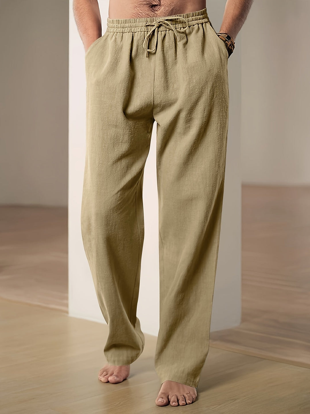 "Men's lightweight relaxed fit lounge trousers with drawstring waist, breathable fabric, shown in stylish grey tone."