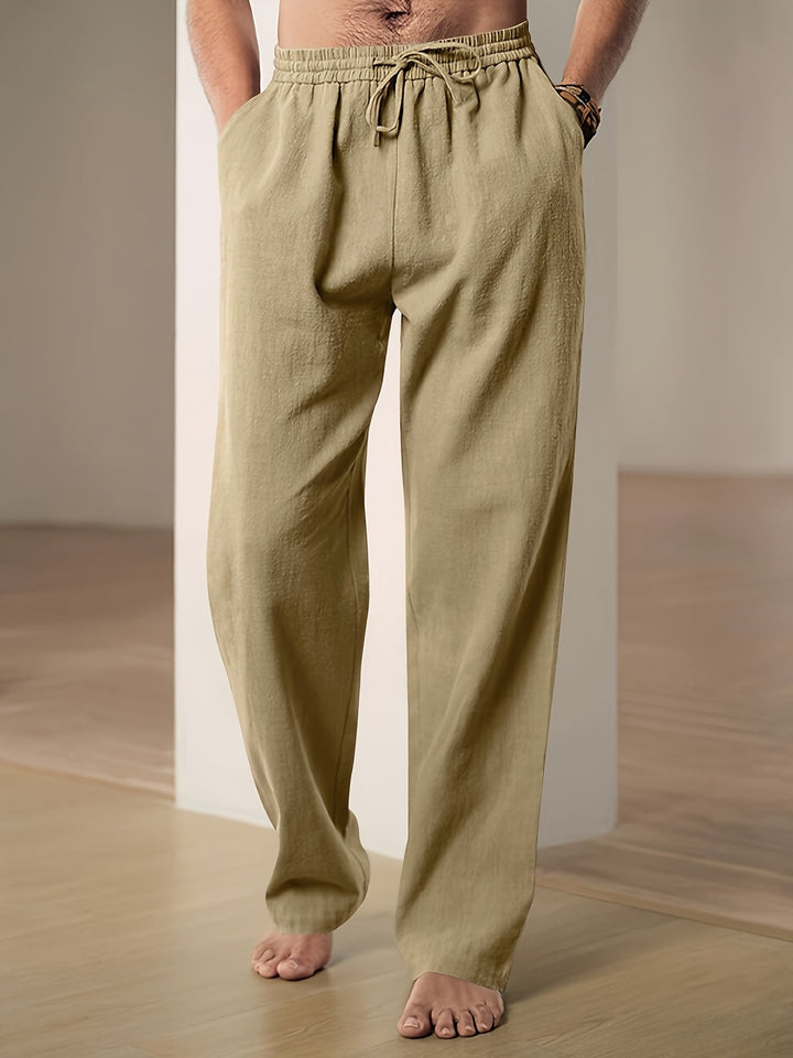 "Men's lightweight relaxed fit lounge trousers with drawstring waist, breathable fabric, shown in stylish grey tone."