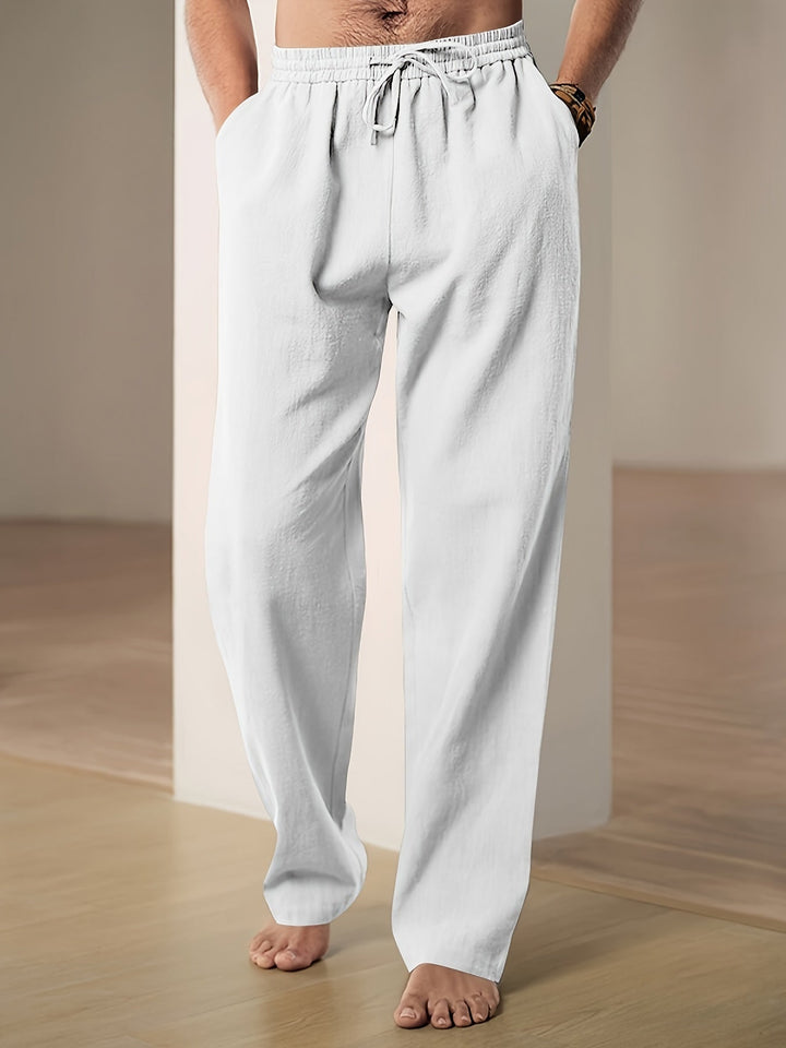 "Men's lightweight relaxed fit lounge trousers with drawstring waist, breathable fabric, shown in stylish grey tone."