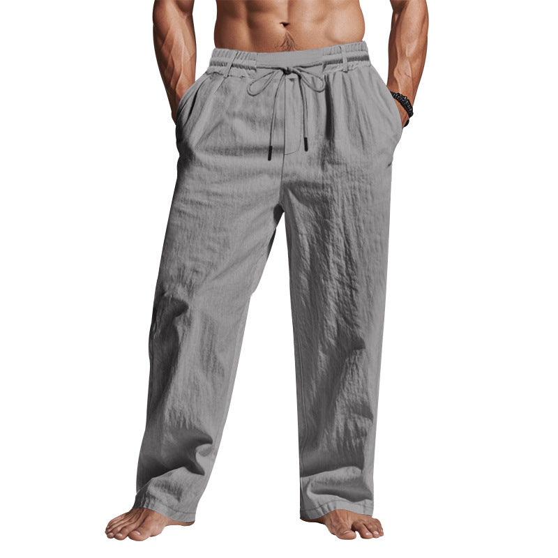 "Men's linen trousers with drawstring waist, relaxed fit, lightweight breathable fabric, ideal for casual and sunny days."