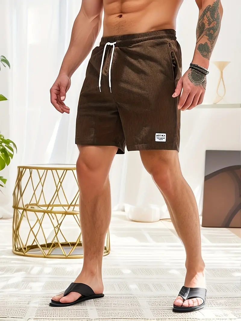 "Men's loose-fit corduroy shorts with drawstring waist in various colors, soft texture, relaxed fit for casual wear."