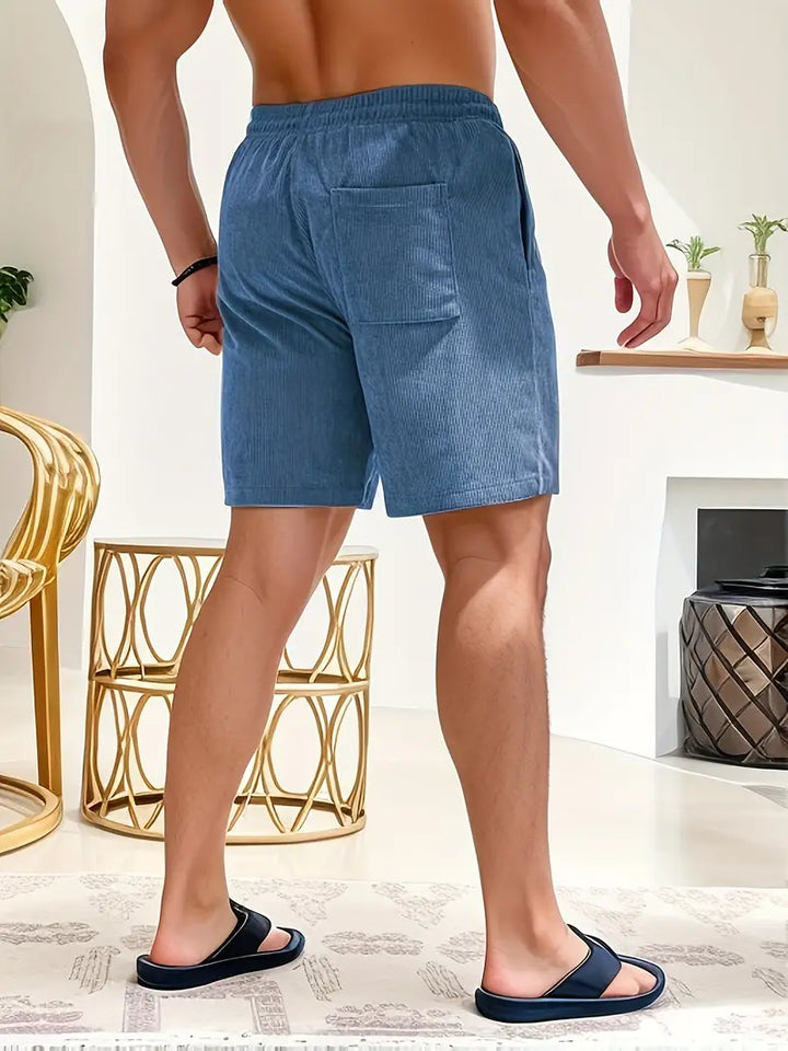 "Men's loose-fit corduroy shorts with drawstring waist in various colors, soft texture, relaxed fit for casual wear."