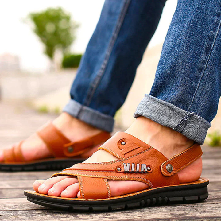 "Men's orthopedic walking sandals with cushioned footbed, open upper, heel strap for comfort and breathability outdoors."