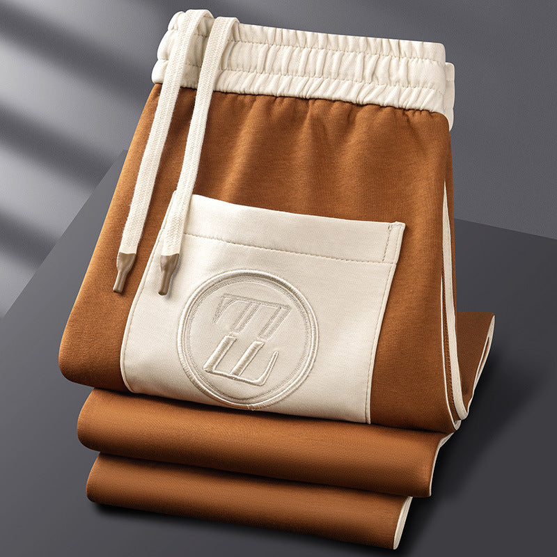 "Men's premium tracksuit set, sleek design, breathable gray fabric, ideal for workouts or lounging, modern comfortable fit"