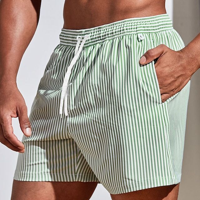 "Men's quick-dry blue striped boardshorts swimwear; lightweight with elastic waistband for beach or pool adventures."