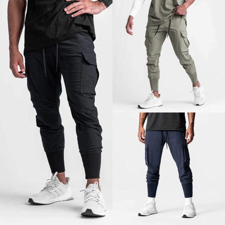 "Men's quick-dry cargo joggers, lightweight with multiple pockets, elastic cuffs, urban style, navy color, displayed front vi