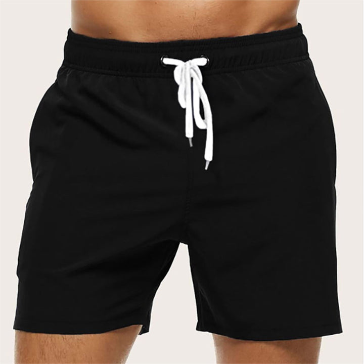 "Men's quick-dry swim trunks with trendy design, elastic waistband, colorful patterns, ideal for beach or pool activities."