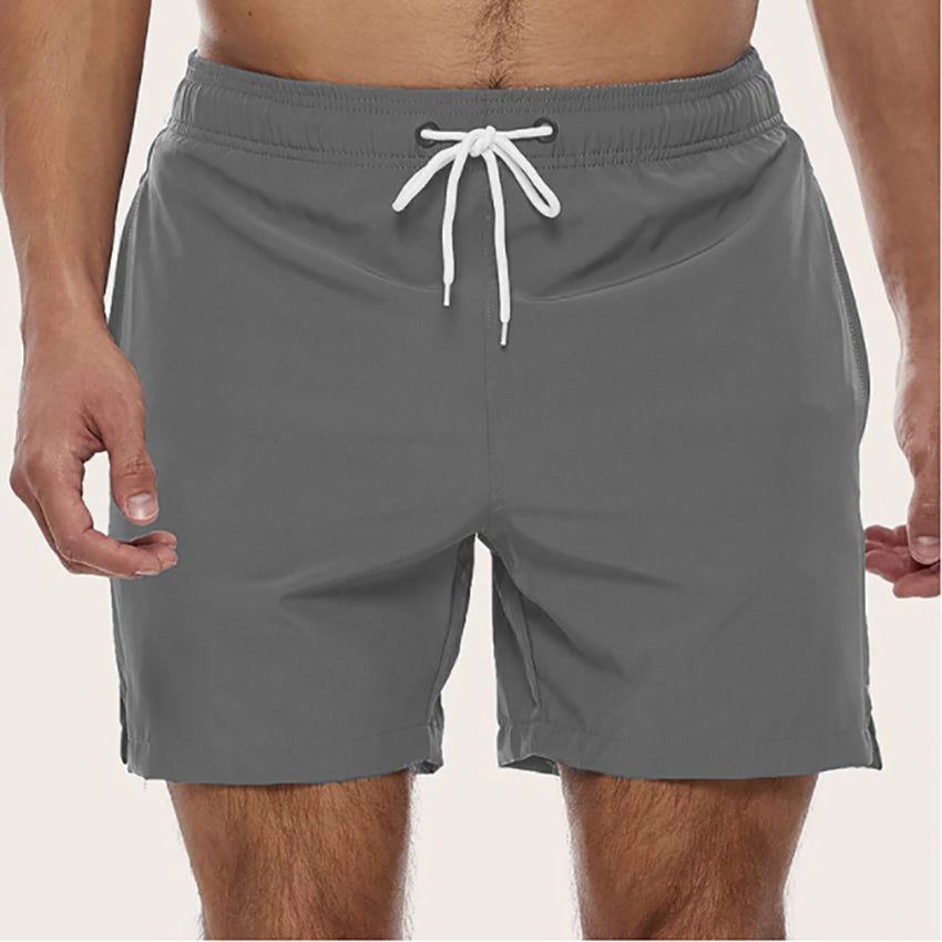 "Men's quick-dry swim trunks with trendy design, elastic waistband, colorful patterns, ideal for beach or pool activities."