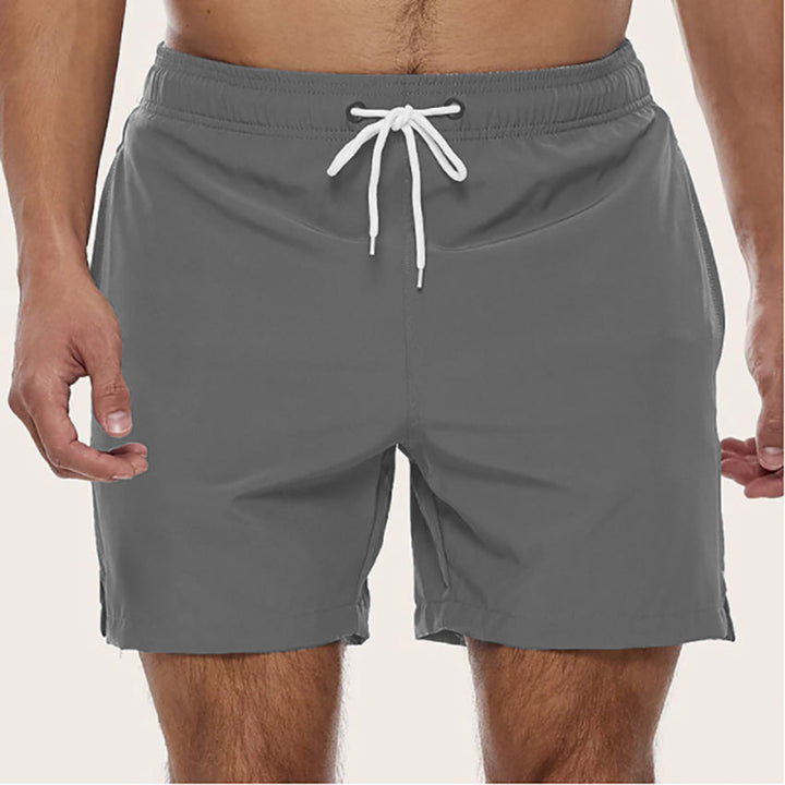 "Men's quick-dry swim trunks with trendy design, elastic waistband, colorful patterns, ideal for beach or pool activities."