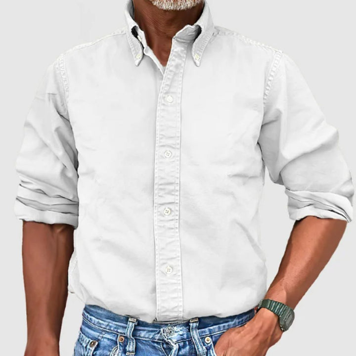 "Men's regular fit long-sleeve button-down shirt with classic collar, rolled cuffs, and durable polyester fabric."