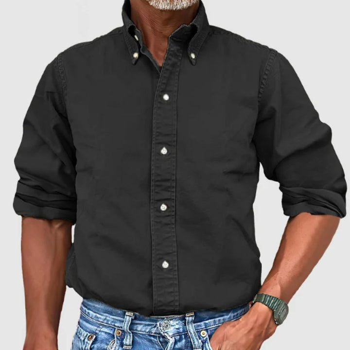 "Men's regular fit long-sleeve button-down shirt with classic collar, rolled cuffs, and durable polyester fabric."