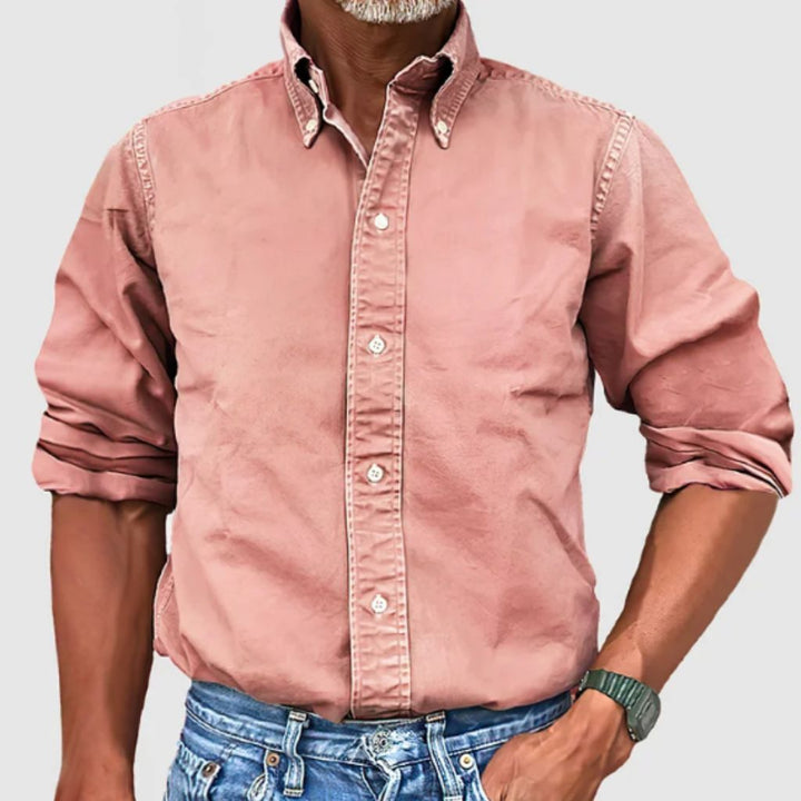 "Men's regular fit long-sleeve button-down shirt with classic collar, rolled cuffs, and durable polyester fabric."